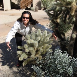 Assana can't help hugging the prickly pears/
		    