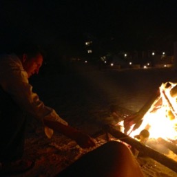 Dan poking our after-dinner fire.../
		    