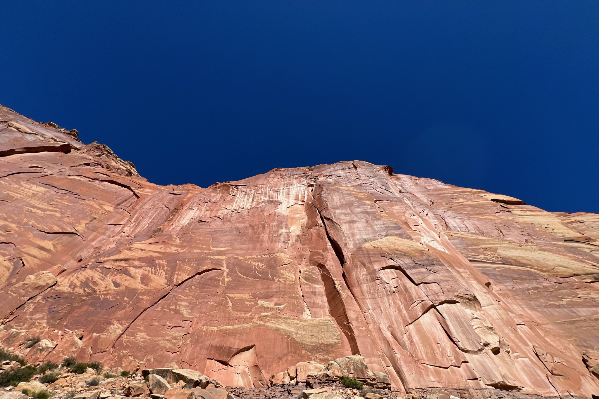 Sheer cliffs.. so pretty with the dark blue sky/