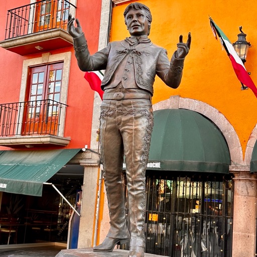 Gay mezcal dude statue/
		    