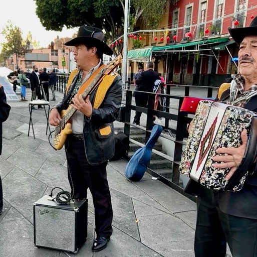 Mariachi bands in Plaza Garibaldi playing for those who pay/
		    