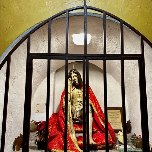 Sad Jesus... probably because he is in a cage/
		    