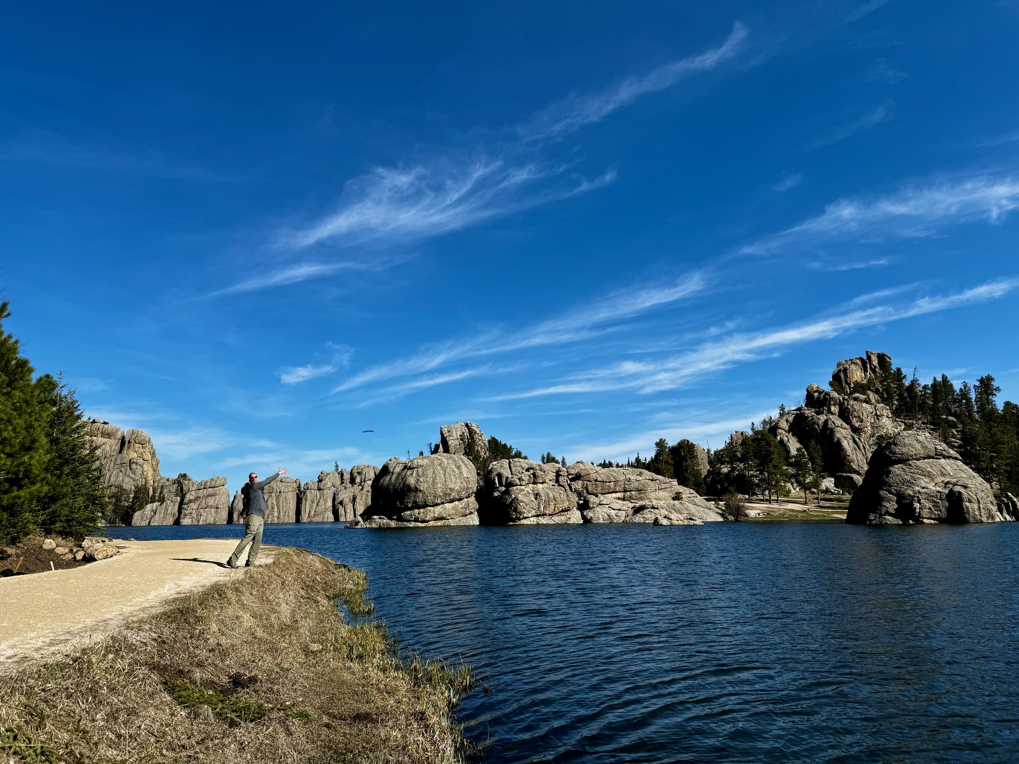 Dan throwing something in the lake/518 SD-87, Custer, SD 57730, USA