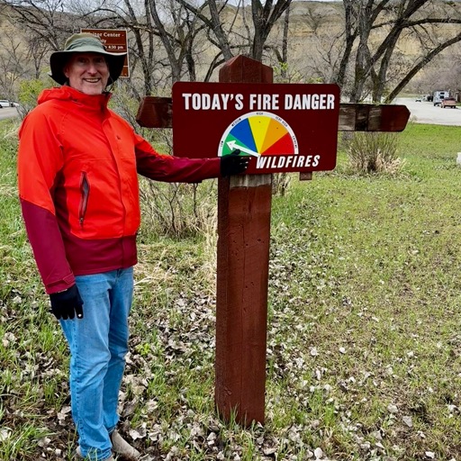 Dan messing with the moderate fire danger as we soak in the rain/
		    201 Main St, Medora, ND 58645, USA