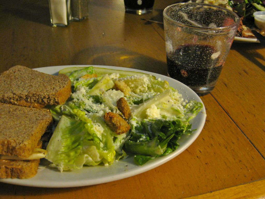 Assana's dinner: ceasar salad, a peanut butter, banana & honey sandwich, red wine!/