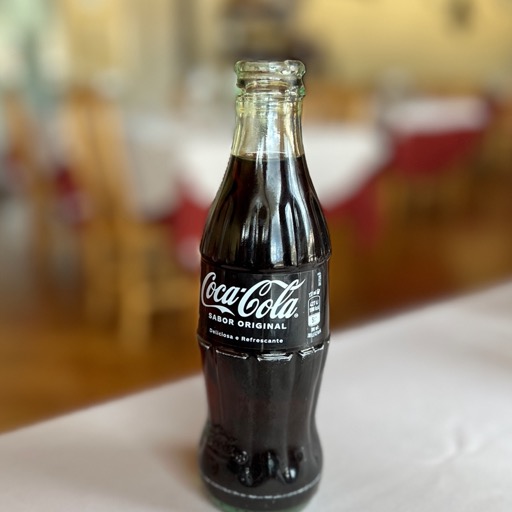 Teeniest ever coke bottle/
		    R. 1º de Maio 9, 6260-188 Manteigas, Portugal