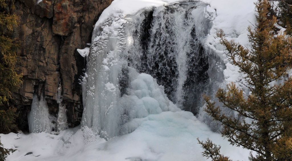 Snow on the frozen waterfall/